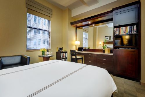 Deluxe Rooms offer more space, a large desk, and a spacious closet perfect for a long stay or a couple looking for comfort.