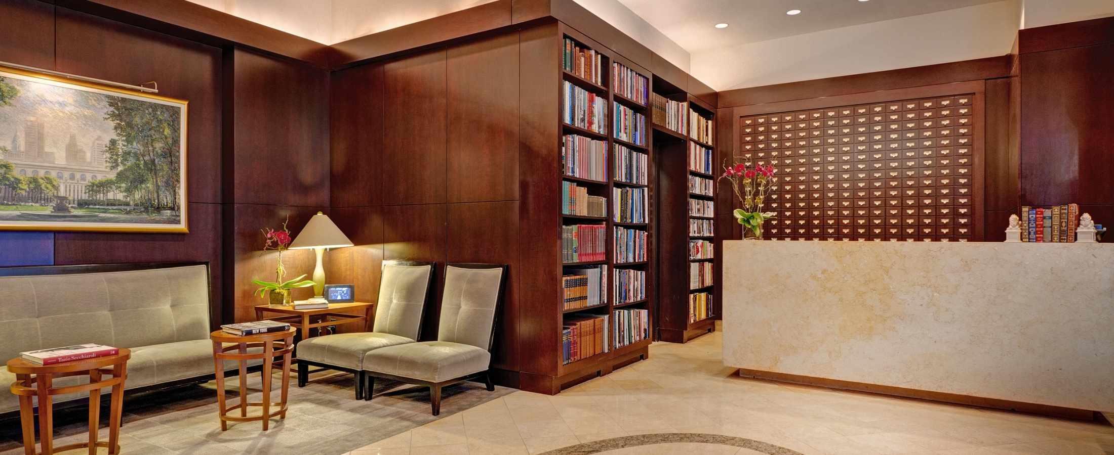 Main Lobby and Front Desk Area at Library Hotel decorated with colorful bookshelves.