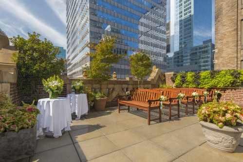 The beautiful wraparound outdoor terrace draws spectacular Manhattan views of the Public Library and surrounding New York architecture.