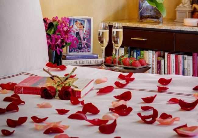 Rose petals laid out on the bed